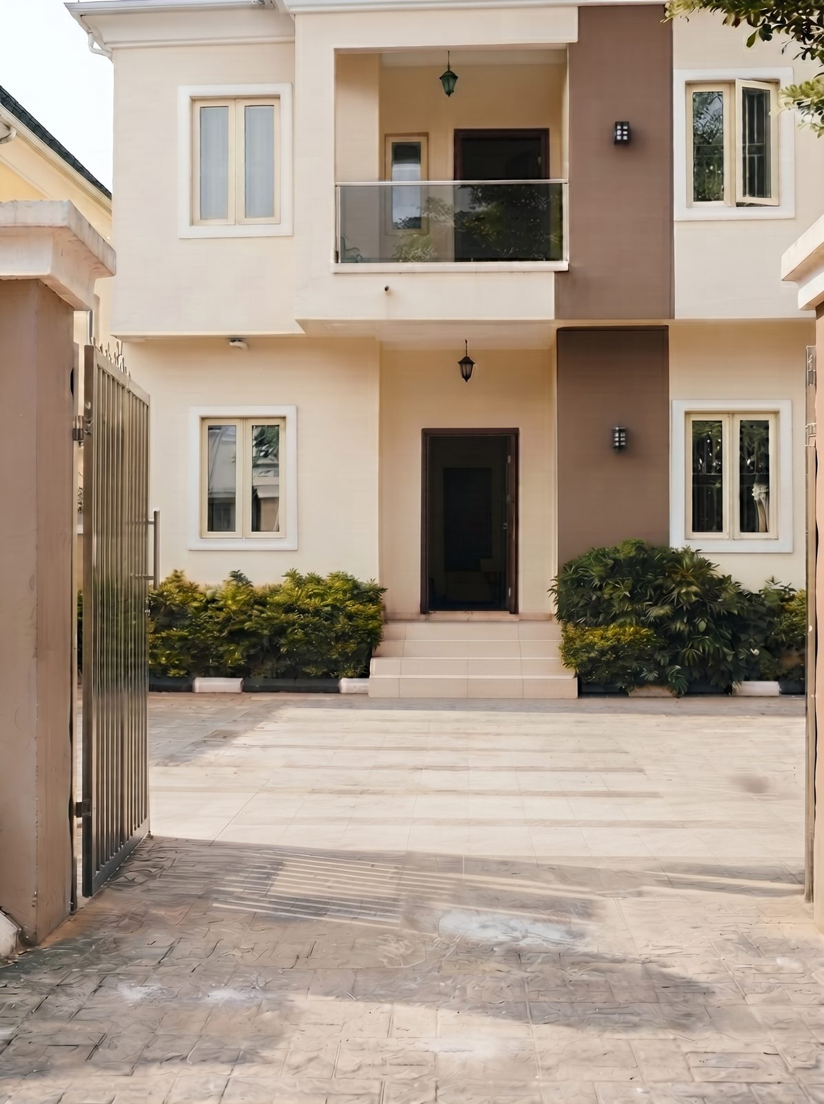 The swept forecourt and entrance of a duplex home after an estate clean